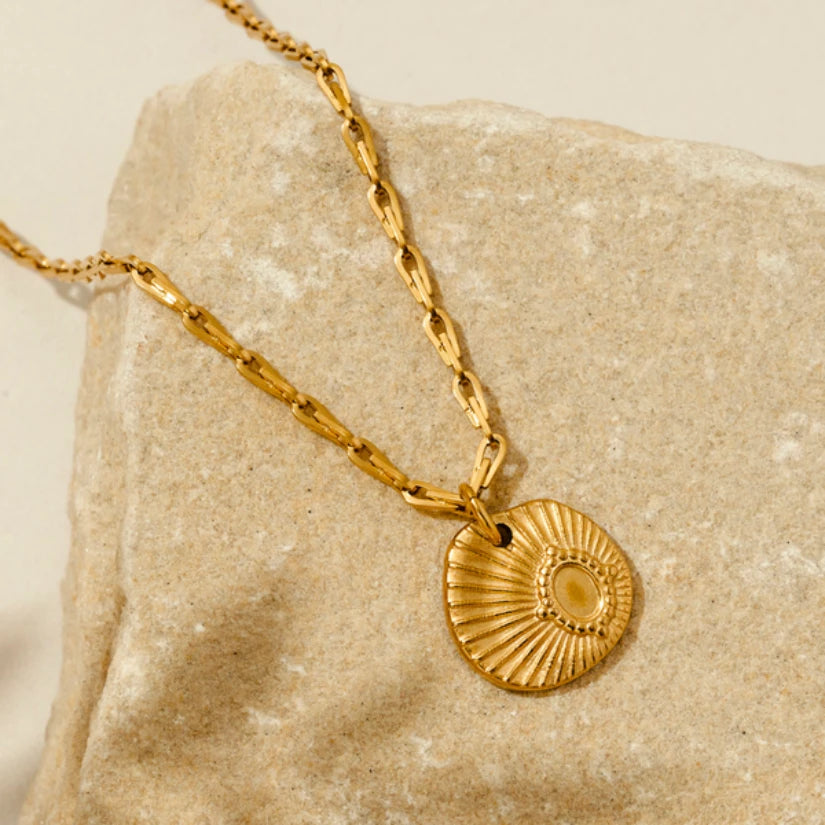 gold coloured coin necklace
